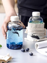 Load image into Gallery viewer, Gradient Blue Whale Water Bottle With Cover, Clear Printed Water Bottle, 600ML Sea Glass, Aesthetic Water Bottle, Portable Water Bottle.

